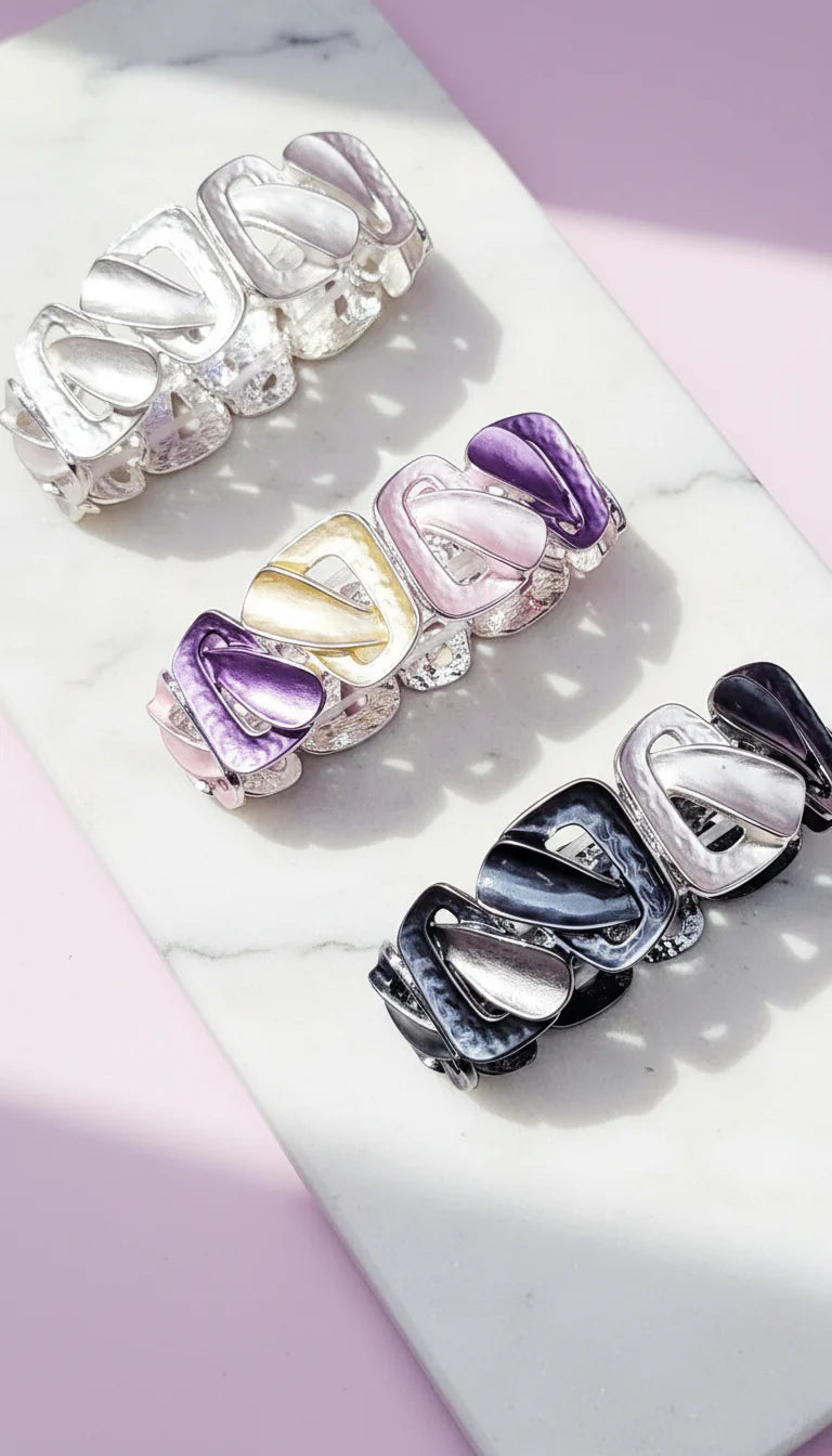Set of colorful bracelets on a marble surface