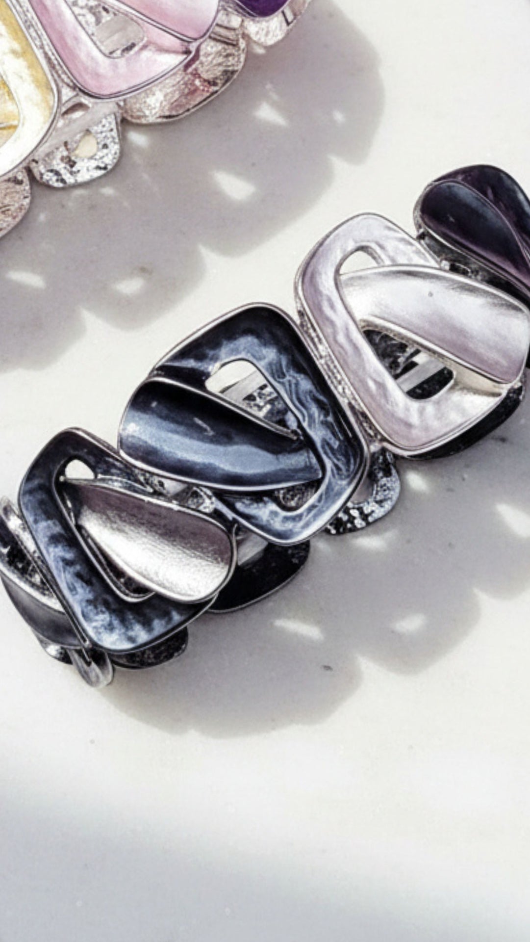 Set of silver bracelet on a light background