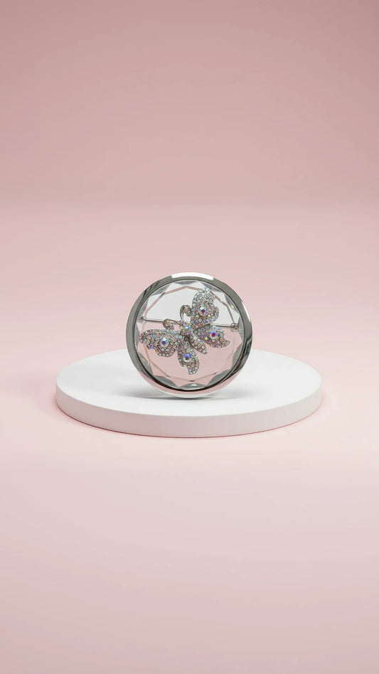 White compact mirror with a butterfly design on a pink background