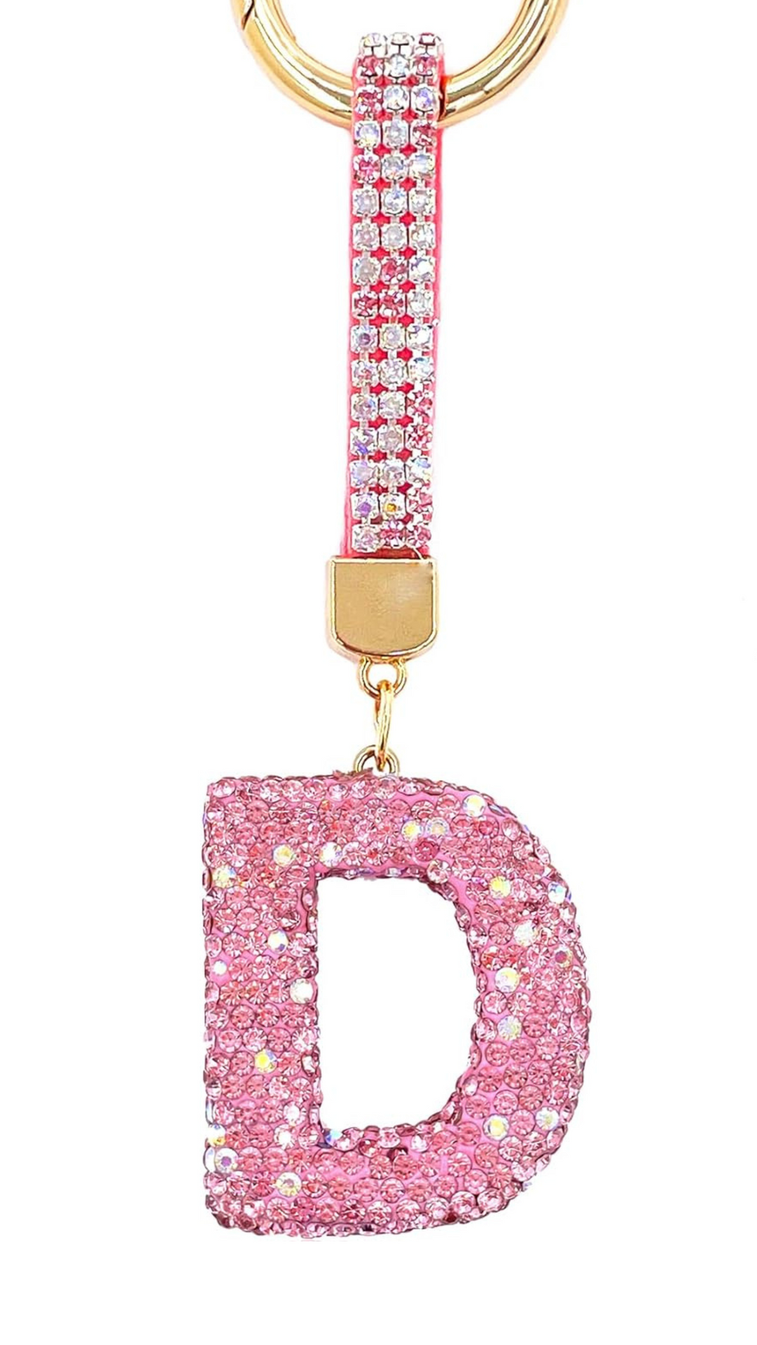 Pink glittery letter 'D' keychain with gold accents on a white background