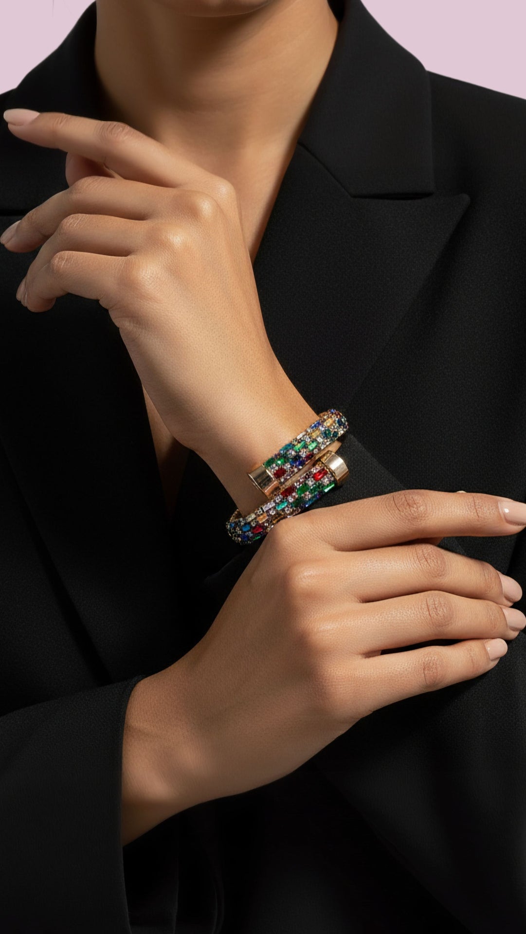 Close-up of a person wearing a colorful bracelet on a black background